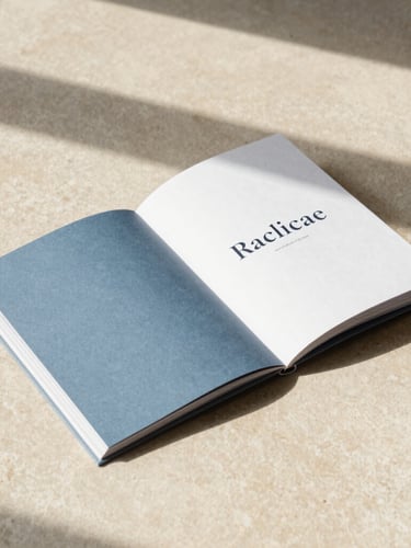 Tactile printed brand book lying open on a light warm beige stone surface, showing clean serif typography, soft natural shadows, minimalist editorial composition.