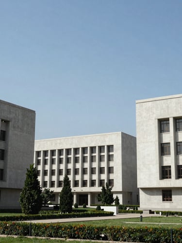 Wide-angle architectural perspective of Islamabad's administrative zone, clean modern concrete institutional facades under bright daylight, cool tones.