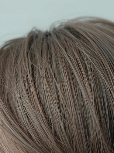 Close-up macro detail of clean, healthy hair strands under soft diffused daylight, shallow depth of field, muted slate blue and warm taupe tones, 35mm photography