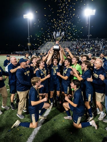 Dynamic low-angle shot of St. Joseph Boys Soccer alumni and current players celebrating on the field after a match, championship trophy visible, stadium floodlights, deep navy and gold tones, sharp focus, wide shot.