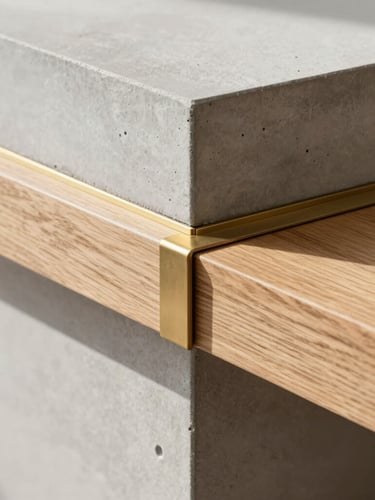 Close-up of premium building materials, raw oak timber meeting smooth cast concrete, brass details, natural side lighting