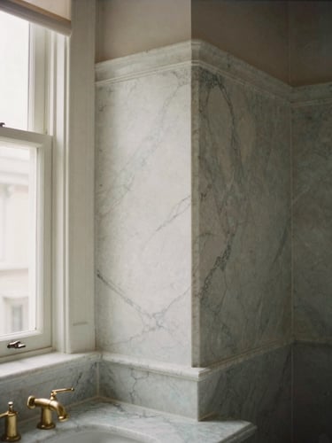 Architectural detail of a luxury bathroom renovation, flawless mitered marble joints, brass fixtures, soft morning light, 35mm film