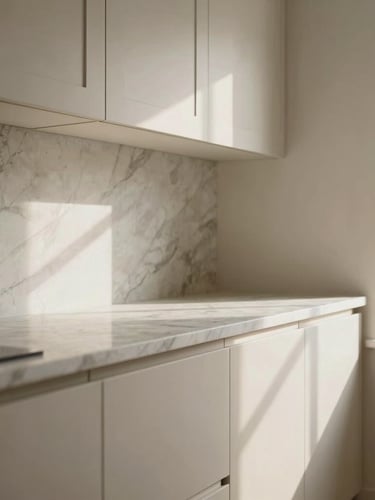 Detailed architectural shot of custom kitchen cabinetry meeting a marble countertop perfectly, soft north-facing daylight, warm neutral tones, high-end craftsmanship.
