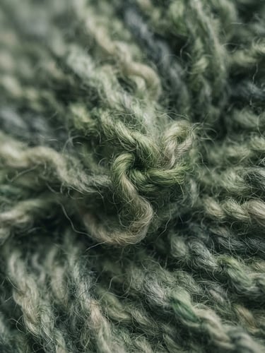 Macro close-up of premium organic cotton fibers, soft lighting, green tones, cinematic editorial photography, sharp focus
