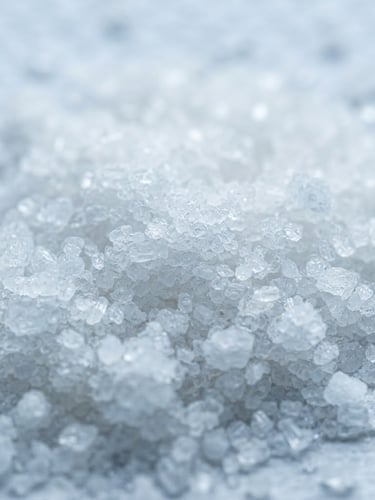 Macro shot of fine, crystalline white sodium hexametaphosphate powder, brightly lit in a sterile laboratory setting, cool blue and white tones, sharp focus.