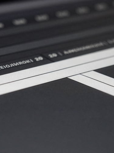 Macro close-up of a dark video editing timeline interface, high-contrast monochrome UI layout, sharp white tracks on deep grey screen, minimalist aesthetic