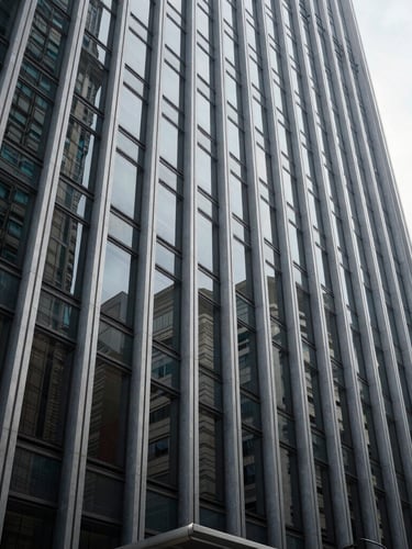 Abstract architectural lines of a modern corporate building in São Paulo, sharp steel and glass facade, cool natural daylight, wide angle shot.