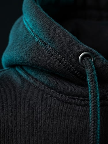 Sleek editorial product photography of a heavy cotton hoodie construction, sharp high-contrast studio lighting, vibrant cyan gel accents against deep black fabric texture, macro detail, 50mm lens