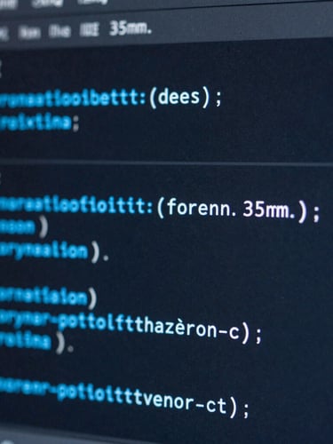 Macro close-up of a high-resolution IDE code interface on a monitor, electric blue syntax highlighting, dark charcoal background, sharp focus, cool-toned studio lighting, 35mm