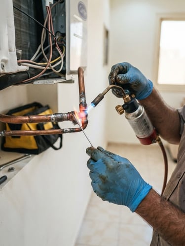 Close-up of hands repairing copper AC pipes with technical tools in a bright Riyadh home setting, crisp commercial photography, 35mm lens