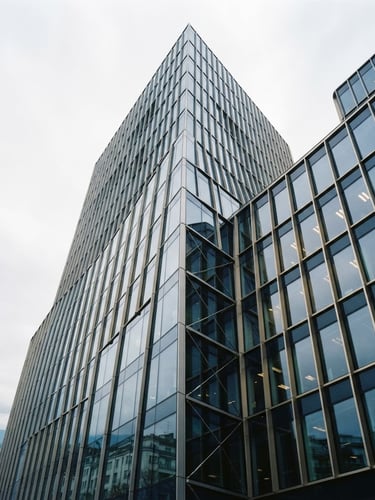 Low-angle architectural shot of a modern financial building facade in Geneva, cool diffused Swiss daylight, sharp glass and steel lines, deep navy tones with subtle warm interior light reflection, 35mm