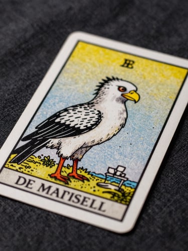 Macro close-up shot of the Bateleur card from the Tarot de Marseille, resting on textured dark linen, dramatic soft side lighting.