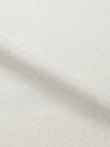 Close-up studio shot of a tactile, neutral-colored cotton fabric with visible weave texture, bright even lighting, soft shadows, crisp focus, minimalist, portrait aspect.