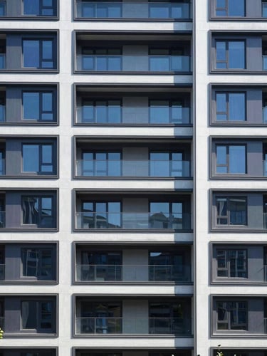 Straight-on architectural elevation of a modern high-end residential facade in Virginia, crisp daylight, structured shadows, deep navy undertones, sharp focus