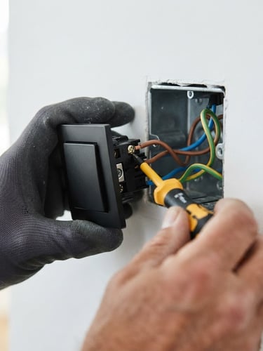 Close-up of a modern, sleek black electrical switch being installed, sharp focus on hands with professional tools, high-contrast lighting, clean background, electric yellow accent.