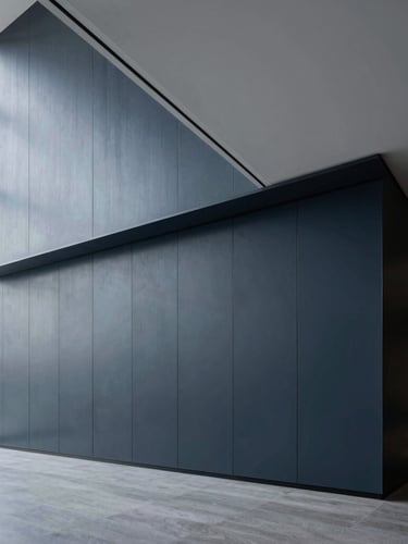 Crisp architectural photography of a modern high-end boardroom with clean geometric lines, cool daylight, deep slate and navy tones, sharp focus, professional corporate aesthetic.