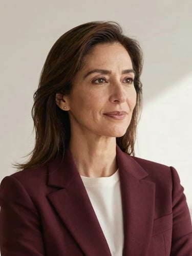 Portrait of elegant female founder Silvia Rosas in her late 40s, professional neutral attire, soft natural side-light, clean architectural background, warm editorial tones.