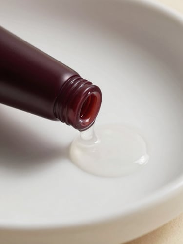 Close-up macro shot of clear, viscous gel texture sliding down a smooth white ceramic surface, elegant shadows, soft lighting