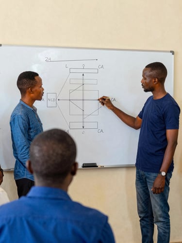 A collaborative workshop in Bouaké, civic leaders analyzing a structural diagram on a whiteboard, bright natural daylight, 35mm editorial style.