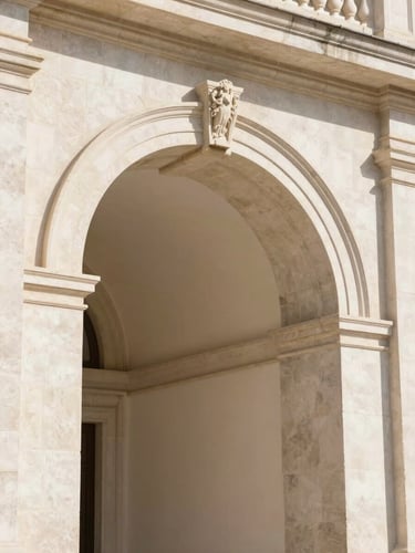 Elegant close-up of a stone classical archway in Madrid, bright natural daylight, soft warm shadows, architectural detail, 35mm lens