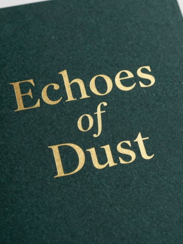 Minimalist book cover design for 'Echoes of Dust' showing a textured, dark sea-green paper background with elegant gold serif typography, soft side-lighting, realistic physical book mockup.