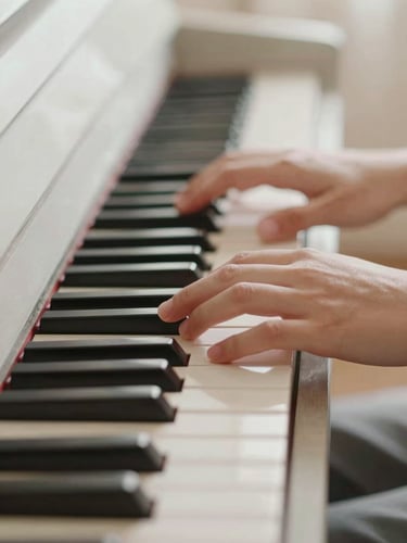 Close-up of hands gently pressing piano keys, soft diffused daylight, muted pastel tones, shallow depth of field, warm and calming atmosphere