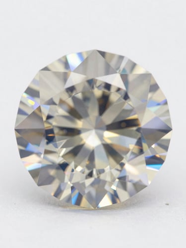 Extreme macro of a brilliant-cut diamond under controlled studio strobe, facets refracting prismatic light against a pure white ground, geometric symmetry of the crown visible in sharp focus