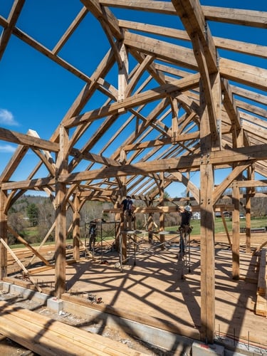 Wide-angle shot of a timber frame structure under construction, sharp geometric shadows, clear blue sky, sunlit.