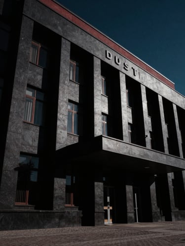 Low-angle dramatic architectural shot of a modern courthouse in Tula, sharp perspective, deep shadows, low-key lighting, high-contrast, cinematic editorial style.