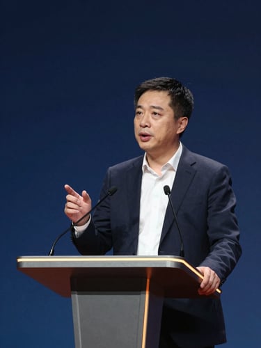 A dynamic corporate leader speaking at a podium under high-contrast spotlight, deep slate blue background, warm amber rim light, modern editorial style.
