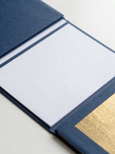 Overhead shot of structured financial documents, clean workspace, soft daylight, navy blue and warm gold accents, 35mm