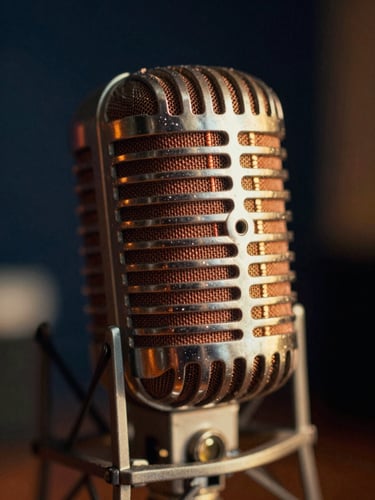 Extreme close-up of a vintage tube microphone in a dimly lit studio, warm golden-hour light reflecting on the copper mesh, soft focus background, 35mm film style