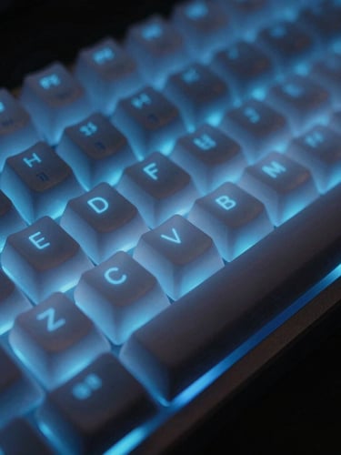 Extreme close-up of a premium custom mechanical keyboard with translucent keycaps, glowing electric blue RGB backlighting, dark moody studio lighting, shallow depth of field.