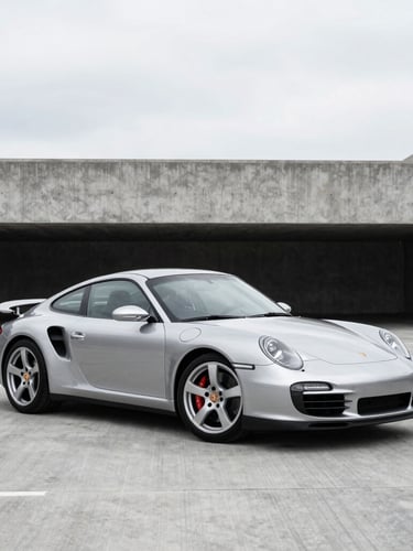 A sleek silver Porsche 911 Turbo parked in a minimalist, high-contrast concrete shipping terminal, overcast daylight, metallic reflections, 50mm lens