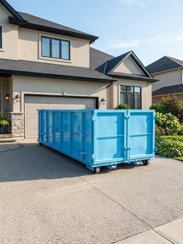 Bright commercial photography of a clean sky blue roll-off dumpster positioned neatly on a pristine residential driveway under bright morning sunlight, sharp focus, wide-angle lens