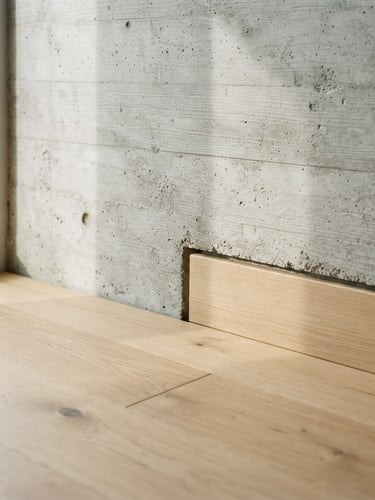 Close-up of raw concrete junction meeting light oak wood, bright natural daylight casting soft geometric shadows, minimalist architectural detail, 35mm lens