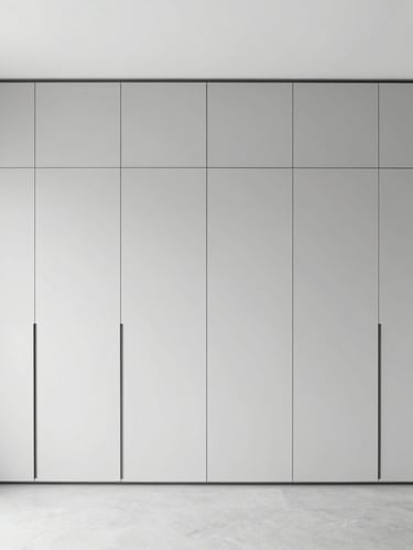 Portrait architectural shot of a sleek minimalist bedroom in Ranchi, integrated floor-to-ceiling storage, bright high-key natural daylight, neutral gray tones, 35mm