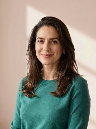 Warm portrait of a female tech founder in a sunlit studio, smiling gently, natural lighting, elegant pastel background, professional yet warm, 35mm editorial photography
