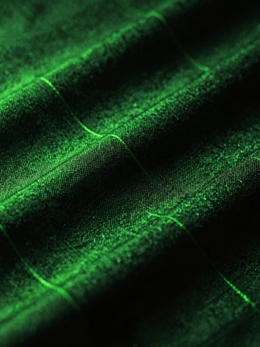 Extreme close-up of technical fabric texture, showing sweat-wicking properties, with subtle neon green rim light on the fibers and deep shadows.