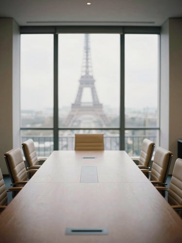 A quiet, modern boardroom in Paris, soft diffused overcast daylight through large windows, empty leather chairs, architectural framing, desaturated sand tones, 35mm film grain.
