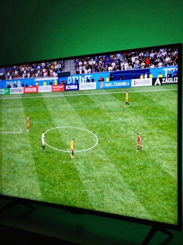 Dynamic close-up of a modern smart TV screen displaying a vibrant live soccer match in a dark room, neon green ambient glow on the wall, 35mm photography