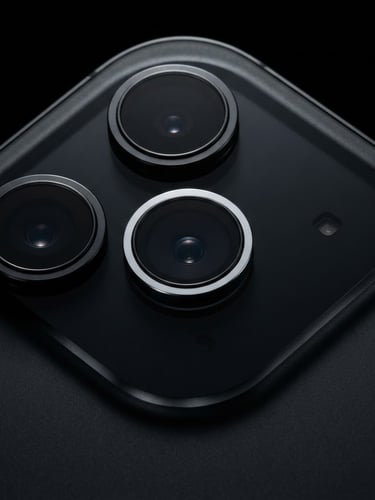 Macro close-up of three pristine iPhone camera lenses on a deep black metallic body, sharp rim lighting, ultra-detailed studio photography, 85mm lens