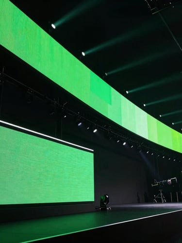Sleek high-end LED screens in action on a massive dynamic event stage, dramatic stage illumination, deep shadows with vibrant green neon pops, 35mm lens