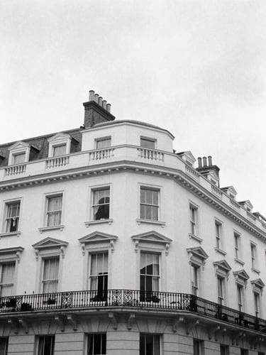 High-contrast editorial black and white photograph of Silverstream House architectural lines in Fitzrovia, soft overcast London daylight, 35mm film