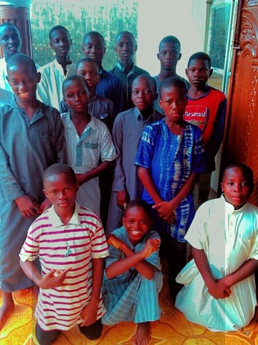 Inspirational image of diverse kids reading the Holy Quran together.