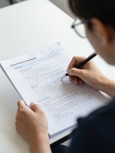 Over-the-shoulder shot of a student analyzing a structured study guide with handwritten notes, bright natural daylight, sharp focus, professional 35mm photography