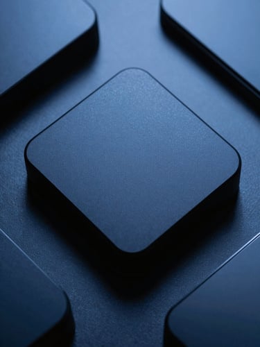 Macro flat-lay of premium matte-black computer peripherals, cool studio lighting with sharp shadows, subtle blue highlights