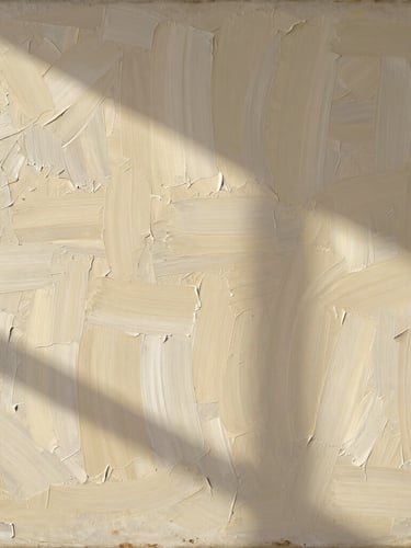 Close-up detail of museum-grade canvas texture showing the thick, structured brushstrokes of a Cezanne reproduction, warm natural light, soft shadows.