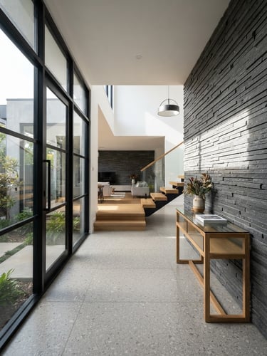 Crisp architectural photography of a modern renovated home interior, clean geometric lines, bright afternoon sun highlighting tile textures.