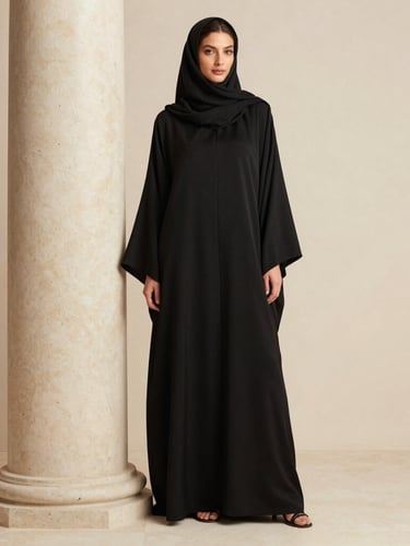 Warm editorial fashion photography, bright soft studio light, a model in a structured black luxury abaya standing next to a travertine column, minimalist neutral tones, medium format, shallow depth of field